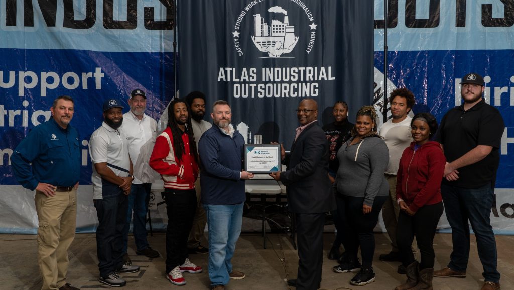 Mobile Chamber Vice President of Small Business Development Darrell Randle presenting the April 2023 Small Business of the Year Award to Atlas Industrial Outsourcing 