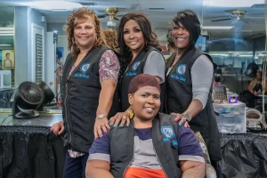 Paula's Hair Unlimited team members posing in the hair salon